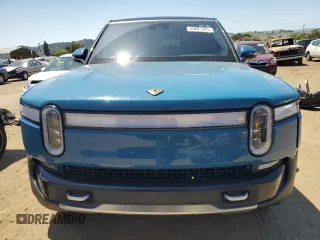2024 Rivian R1S Adventure z VIN 7PDSGBBA0RN034793, wystawiony jako Copart lot #55091885 z przebiegiem 20 154 mil mil oraz Szkody całkowita. Historia ofert i sprzedaży dostępna na DreamBid. Obrazek 5.
