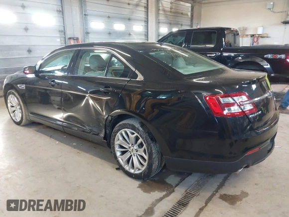 2015 Ford Taurus Limited with VIN 1FAHP2J87FG172580, listed as a IAAI auction lot 41891567 with 183,784 mi miles. Bid and sale history available at carsss.com. Image 3.