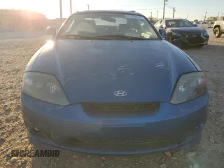 2005 Hyundai Tiburon GT z VIN KMHHN65F35U186438, wystawiony jako Copart lot #41879955 z przebiegiem 152 574 mil mil oraz Szkoda całkowita • Salvage title. Historia ofert i sprzedaży dostępna na DreamBid. Obrazek 5.