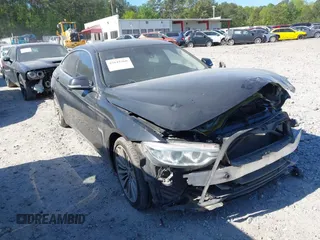 2015 BMW 4 Series 428i with VIN WBA4A5C51FG051393, listed as a IAAI auction lot 42041960 with 136,929 mi miles and . Bid and sale history available at carsss.com. Image 1.