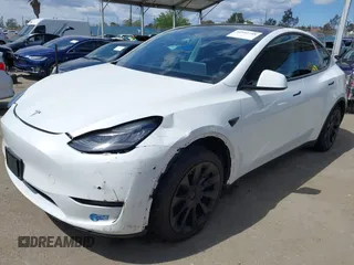 2020 Tesla Model Y Long Range with VIN 5YJYGDEE2LF058515, listed as a IAAI auction lot 41932748 with 62,885 mi miles and . Bid and sale history available at DreamBid. Image 23.