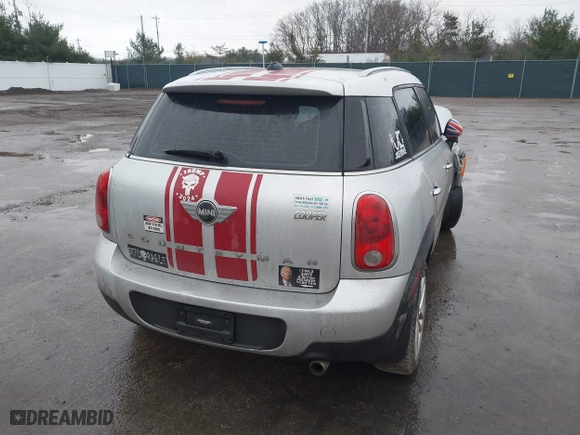 2013 MINI Cooper Countryman with VIN WMWZB3C5XDWR35844, listed as a IAAI auction lot 41203877 with 118,000 mi miles. Bid and sale history available at carsss.com. Image 4.