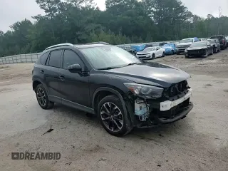 2016 Mazda CX-5 Grand Touring z VIN JM3KE2DY5G0676290, wystawiony jako Copart lot #54155325 z przebiegiem 124 743 mil mil oraz Szkoda całkowita • Salvage title. Historia ofert i sprzedaży dostępna na DreamBid. Obrazek 15.
