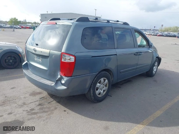 2006 Kia Sedona LX with VIN KNDMB233966090557, listed as a IAAI auction lot 42079046 with 198,851 mi miles. Bid and sale history available at carsss.com. Image 4.