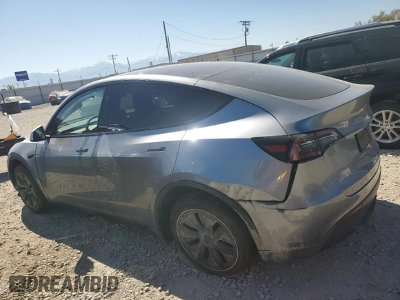 2024 Tesla Model Y Long Range with VIN 7SAYGDEE6RA321064, listed as a Copart auction lot 58889795 with 48,857 mi miles and Salvage title. Bid and sale history available at DreamBid. Image 2.