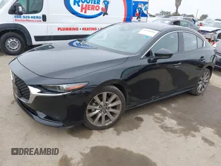 2021 Mazda 3 Premium with VIN JM1BPADL4M1329041, listed as a IAAI auction lot 42291604 with 93,248 mi miles and . Bid and sale history available at DreamBid. Image 19.