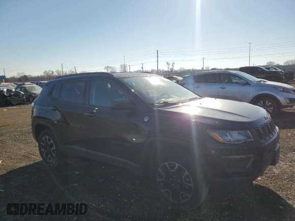 2019 Jeep Compass Trailhawk with VIN 3C4NJDDB1KT727756, listed as a Copart auction lot 42439055 with 104,525 mi miles and Salvage Title. Bid and sale history available at carsss.com. Image 4.
