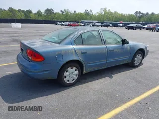 1999 Oldsmobile Alero GL z VIN 1G3NL52TXXC339892, wystawiony jako IAAI lot #41935539 z przebiegiem 315 555 mil mil oraz . Historia ofert i sprzedaży dostępna na DreamBid. Obrazek 4.