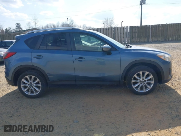 2015 Mazda CX-5 Grand Touring with VIN JM3KE4DY5F0469098, listed as a IAAI auction lot 41858792 with 174,883 mi miles. Bid and sale history available at carsss.com. Image 14.
