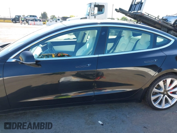 2019 Tesla Model 3 Long Range with VIN 5YJ3E1EB9KF231742, listed as a IAAI auction lot 42114608 with 86,657 mi miles and . Bid and sale history available at DreamBid. Image 15.