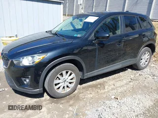 2014 Mazda CX-5 Touring with VIN JM3KE4CY8E0333029, listed as a IAAI auction lot 41857199 with 218,887 mi miles. Bid and sale history available at carsss.com. Image 2.