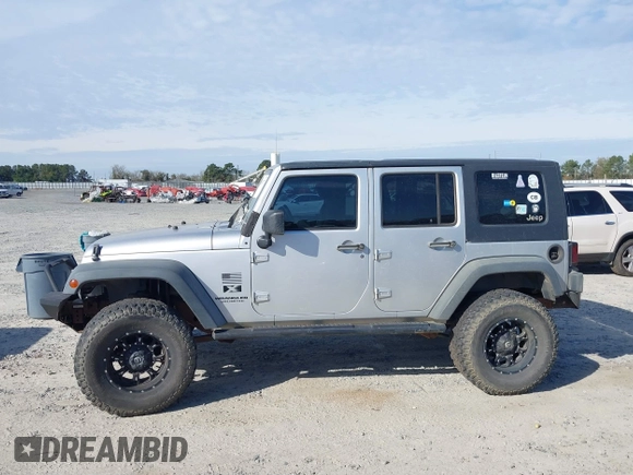 2007 Jeep Wrangler Unlimited X with VIN 1J4GB39147L199367, listed as a IAAI auction lot 40897772 with 229,309 mi miles and . Bid and sale history available at DreamBid. Image 14.