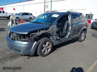 2010 Dodge Journey SXT with VIN 3D4PG5FV3AT146880, listed as a IAAI auction lot 41648379 with 123,341 mi miles. Bid and sale history available at carsss.com. Image 2.