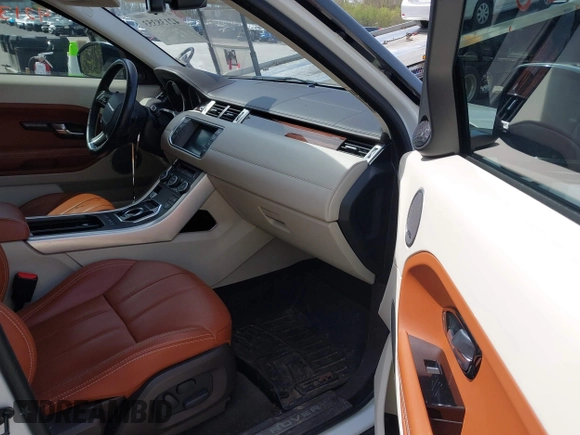 2015 Land Rover Range Rover Evoque Prestige with VIN SALVV2BG4FH076675, listed as a IAAI auction lot 42138353 with 99,751 mi miles and . Bid and sale history available at DreamBid. Image 5.