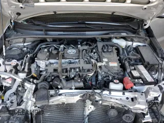 2021 Toyota Corolla Hybrid LE with VIN JTDEAMDE4MJ018825, listed as a Copart auction lot 50895965 with 93,988 mi miles and Salvage Title. Bid and sale history available at carsss.com. Image 12.
