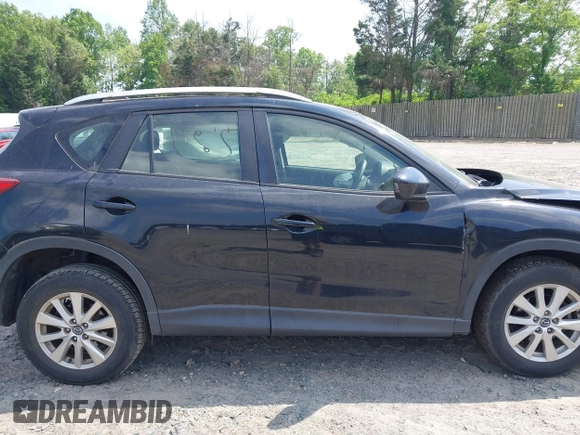 2014 Mazda CX-5 Sport with VIN JM3KE2BE3E0405976, listed as a IAAI auction lot 42161069 with 66,301 mi miles and . Bid and sale history available at carsss.com. Image 13.