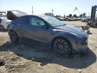 2023 Tesla Model Y Performance with VIN 7SAYGDEF0PF915030, listed as a Copart auction lot 50159375 with 19,772 mi miles and Salvage Title. Bid and sale history available at DreamBid. Image 4.