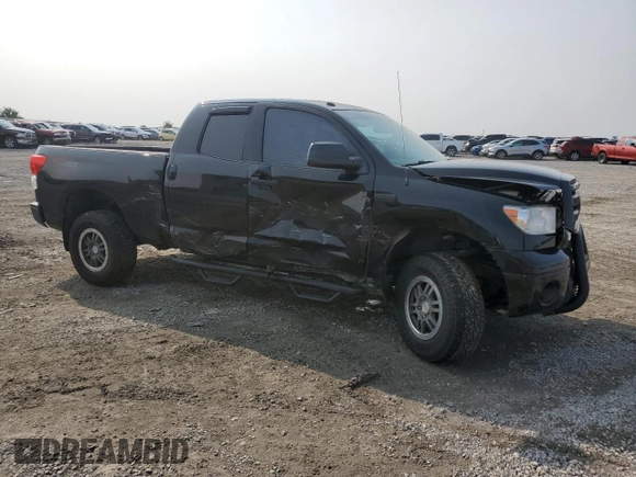 2012 Toyota Tundra with VIN 5TFUW5F10CX213930, listed as a Copart auction lot 60213445 with 147,371 mi miles and Salvage title. Bid and sale history available at DreamBid. Image 4.