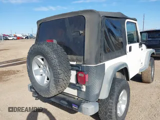 2005 Jeep Wrangler Sport with VIN 1J4FA49SX5P336380, listed as a IAAI auction lot 41752554 with 139,004 mi miles. Bid and sale history available at carsss.com. Image 6.