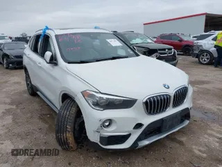 2019 BMW X1 xDrive28i with VIN WBXHT3C51K5L90392, listed as a IAAI auction lot 41571403 with 96,732 mi miles. Bid and sale history available at carsss.com. Image 1.