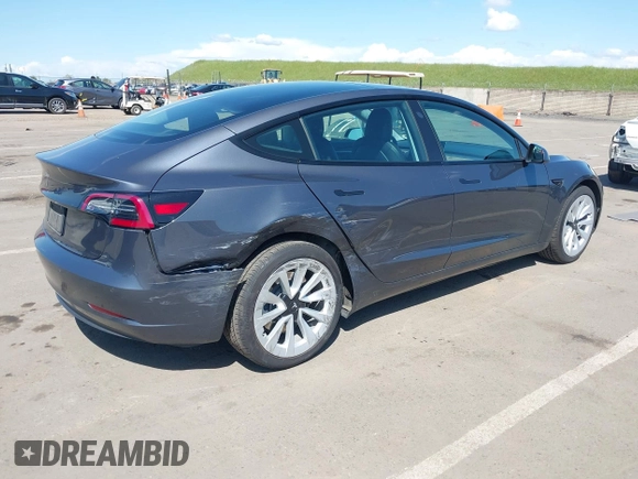 2022 Tesla Model 3 with VIN 5YJ3E1EA6NF144098, listed as a IAAI auction lot 41965360 with 75,597 mi miles. Bid and sale history available at carsss.com. Image 4.