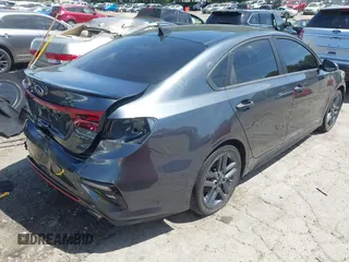 2021 Kia Forte GT-Line z VIN 3KPF34AD2ME341973, wystawiony jako IAAI lot #42084462 z przebiegiem 61 542 mil mil oraz . Historia ofert i sprzedaży dostępna na DreamBid. Obrazek 4.