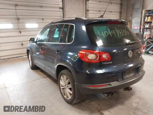 2011 Volkswagen Tiguan SE with VIN WVGBV7AXXBW533872, listed as a IAAI auction lot 40197835 with 104,685 mi miles and . Bid and sale history available at DreamBid. Image 3.