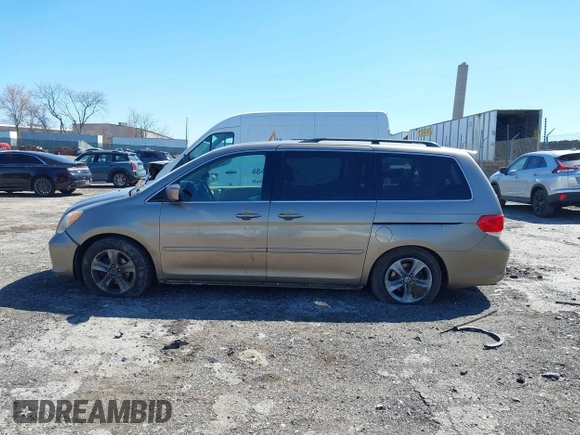 2010 Honda Odyssey Touring with VIN 5FNRL3H9XAB094765, listed as a IAAI auction lot 41892743 with 127,143 mi miles. Bid and sale history available at carsss.com. Image 14.