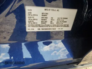 2023 Tesla Model Y Long Range z VIN 7SAYGDEE3PA178832, wystawiony jako Copart lot #57156005 z przebiegiem 12 920 mil mil oraz Szkody całkowita. Historia ofert i sprzedaży dostępna na DreamBid. Obrazek 12.