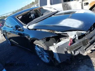 2014 Tesla Model S 60 z VIN 5YJSA1H17EFP53669, wystawiony jako IAAI lot #41351892 z przebiegiem 93 207 mil mil oraz . Historia ofert i sprzedaży dostępna na DreamBid. Obrazek 1.