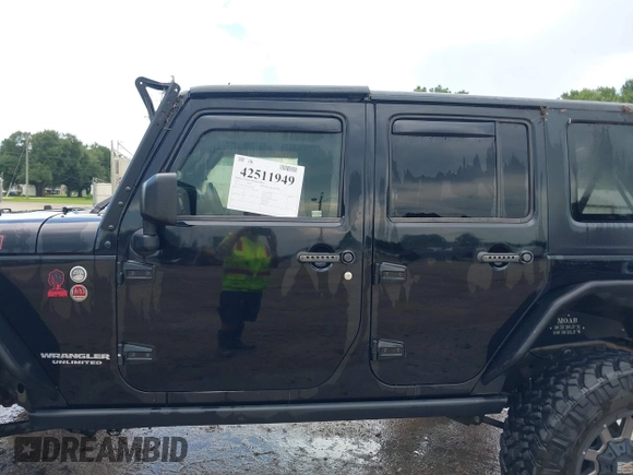 2015 Jeep Wrangler Unlimited Rubicon Hard Rock with VIN 1C4HJWFG0FL674700, listed as a IAAI auction lot 42511949 with 138,370 mi miles and . Bid and sale history available at DreamBid. Image 14.