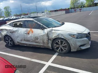 2018 Nissan Maxima S with VIN 1N4AA6AP7JC375048, listed as a IAAI auction lot 42001856 with 109,284 mi miles and . Bid and sale history available at DreamBid. Image 13.