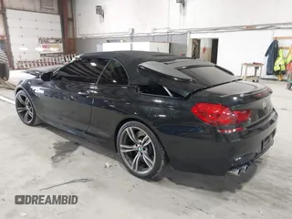 2014 BMW M6 z VIN WBSLZ9C58EDZ78401, wystawiony jako IAAI lot #41840114 z przebiegiem 23 499 mil mil oraz . Historia ofert i sprzedaży dostępna na DreamBid. Obrazek 3.