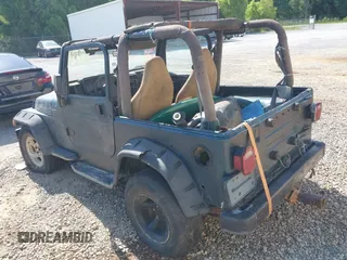 1998 Jeep Wrangler Sport with VIN 1J4FY19S2WP710055, listed as a IAAI auction lot 42680216 with Not provided miles and . Bid and sale history available at DreamBid. Image 3.