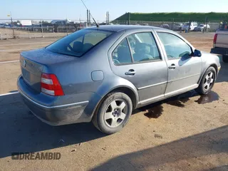 2004 Volkswagen Jetta GL z VIN 3VWRA69M64M044291, wystawiony jako IAAI lot #41882666 z przebiegiem 205 029 mil mil oraz . Historia ofert i sprzedaży dostępna na DreamBid. Obrazek 4.