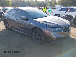 2019 Acura TLX w/A-Spec Pkg z VIN 19UUB2F67KA005049, wystawiony jako IAAI lot #40263144 z przebiegiem 52 093 mil mil oraz . Historia ofert i sprzedaży dostępna na DreamBid. Obrazek 1.
