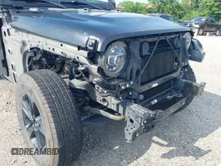 2020 Jeep Wrangler Unlimited Sahara High Altitude with VIN 1C4HJXEGXLW182581, listed as a IAAI auction lot 42612084 with 52,656 mi miles and . Bid and sale history available at DreamBid. Image 6.