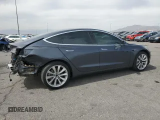 2019 Tesla Model 3 Mid Range z VIN 5YJ3E1EA2KF417212, wystawiony jako Copart lot #50968615 z przebiegiem 104 807 mil mil oraz Szkody całkowita. Historia ofert i sprzedaży dostępna na DreamBid. Obrazek 3.