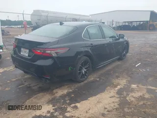 2023 Toyota Camry SE with VIN 4T1G11AKXPU827360, listed as a IAAI auction lot 42217356 with 57,497 mi miles and . Bid and sale history available at DreamBid. Image 4.