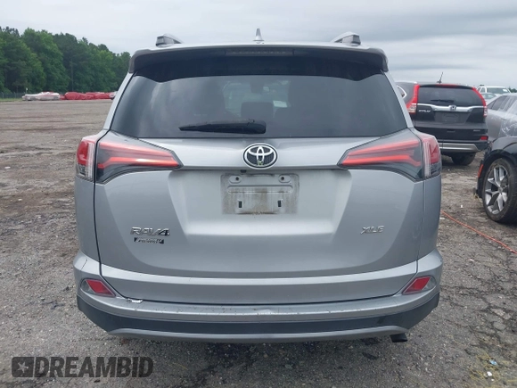 2018 Toyota RAV4 XLE with VIN 2T3WFREV4JW486939, listed as a IAAI auction lot 42355448 with 133,655 mi miles and . Bid and sale history available at DreamBid. Image 16.