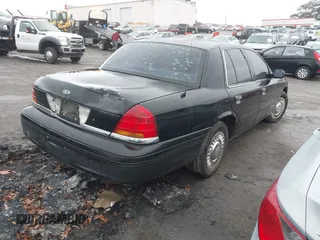 1999 Ford Crown Victoria Police with VIN 2FAFP71W3XX130521, listed as a IAAI auction lot 41384939 with 257,504 mi miles. Bid and sale history available at carsss.com. Image 4.