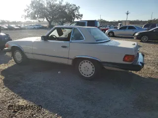 1988 Mercedes-Benz 560 SL with VIN WDBBA48D5JA080281, listed as a Copart auction lot 77695694 with 123,913 mi miles and Salvage Title. Bid and sale history available at carsss.com. Image 2.