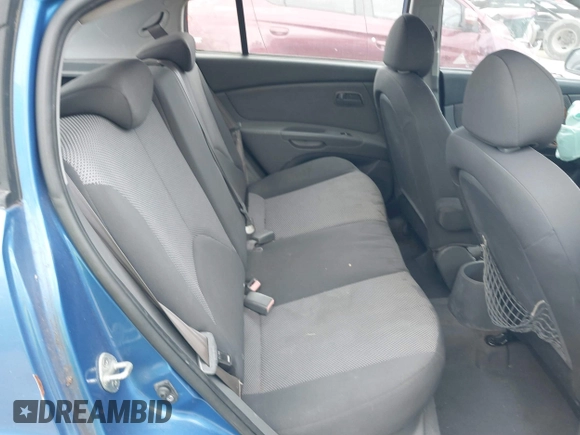 2009 Kia Rio LX with VIN KNADE243296494243, listed as a IAAI auction lot 41307888 with 133,487 mi miles. Bid and sale history available at carsss.com. Image 8.