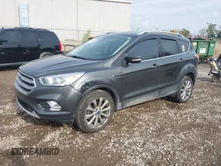 2017 Ford Escape Titanium with VIN 1FMCU9J98HUA49434, listed as a IAAI auction lot 40710866 with 143,850 mi miles. Bid and sale history available at carsss.com. Image 17.