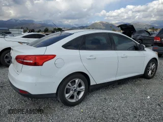 2016 Ford Focus SE with VIN 1FADP3F21GL284681, listed as a Copart auction lot 51140975 with 141,704 mi miles and Salvage Title. Bid and sale history available at DreamBid. Image 3.