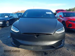 2020 Tesla Model X Long Range with VIN 5YJXCDE28LF298553, listed as a IAAI auction lot 40863184 with 54,031 mi miles and . Bid and sale history available at DreamBid. Image 12.