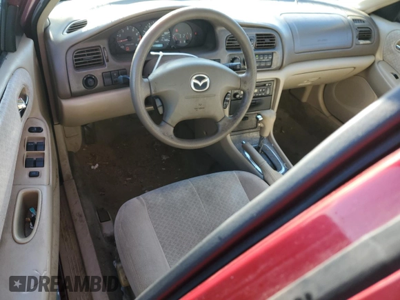 2000 Mazda 626 LX z VIN 1YVGF22CXY5172092, wystawiony jako Copart lot #81960694 z przebiegiem 214 185 mil mil oraz Szkoda całkowita • Salvage title. Historia ofert i sprzedaży dostępna na DreamBid. Obrazek 8.
