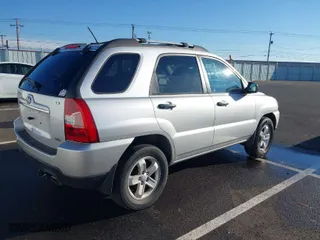 2009 Kia Sportage LX with VIN KNDJE723X97575927, listed as a IAAI auction lot 41014278 with 143,376 mi miles. Bid and sale history available at carsss.com. Image 4.