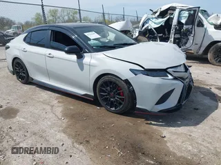 2021 Toyota Camry XSE with VIN 4T1KZ1AK4MU056845, listed as a IAAI auction lot 42221649 with 56,889 mi miles and . Bid and sale history available at DreamBid. Image 1.