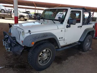 2007 Jeep Wrangler X with VIN 1J4FA24137L128418, listed as a IAAI auction lot 42317921 with 148,412 mi miles and . Bid and sale history available at DreamBid. Image 2.